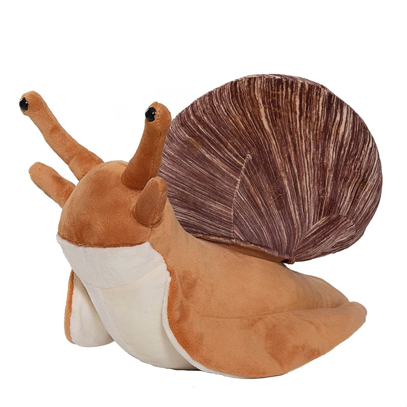 Kawaii snail plush doll displayed on desk shelf as part of kawaii room decor