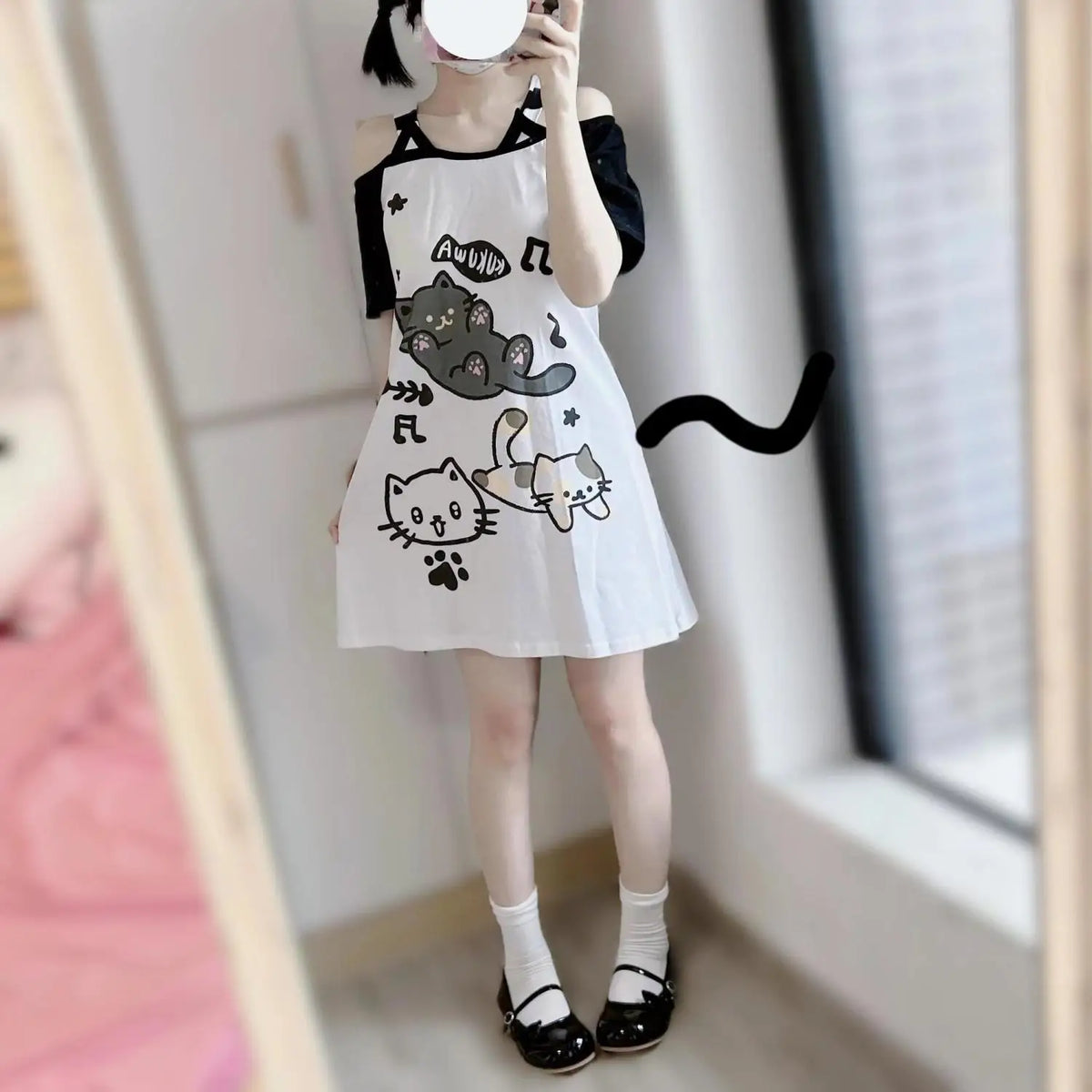 Japanese kawaii cat graphic tee worn off-shoulder, Harajuku street style look