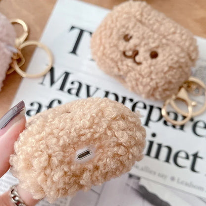 Kawaii fluffy dog AirPods case pink colorway lifestyle flat lay