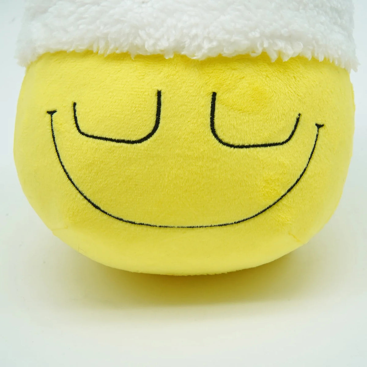 Dozing Dozer plushie close-up drowsy half-moon eyes short-pile polyester detail