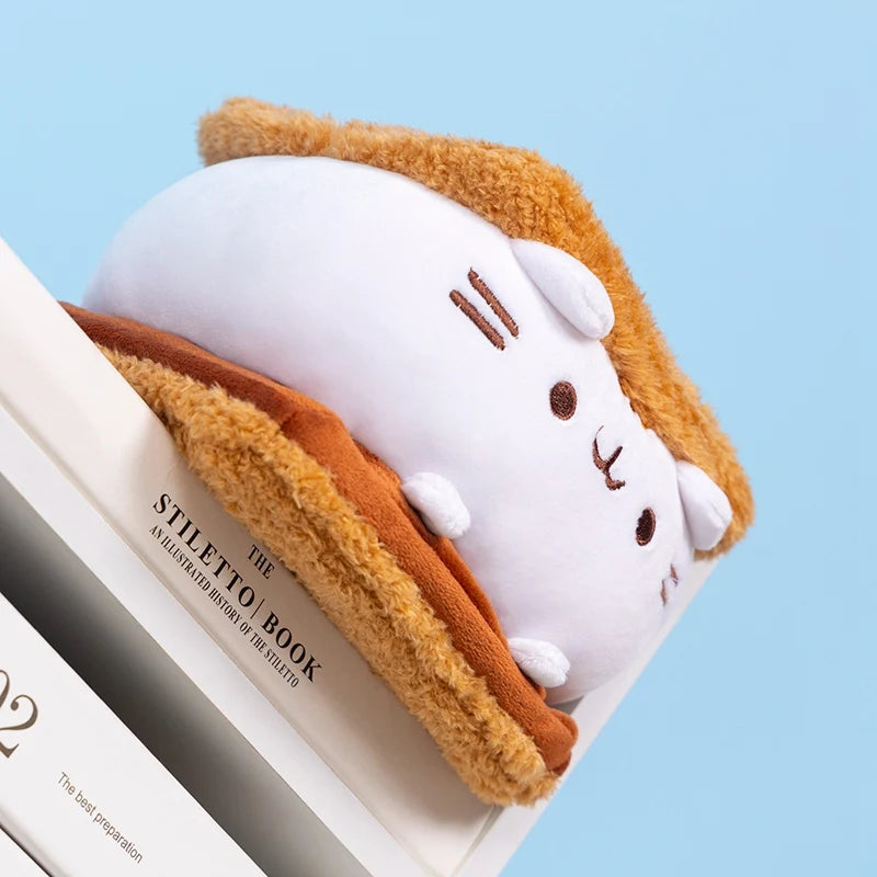 Kawaii fat cat plush displayed on sofa as decorative pillow accent
