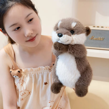 Kawaii otter stuffed animal lying on back showing soft cream belly fabric and tail stitching