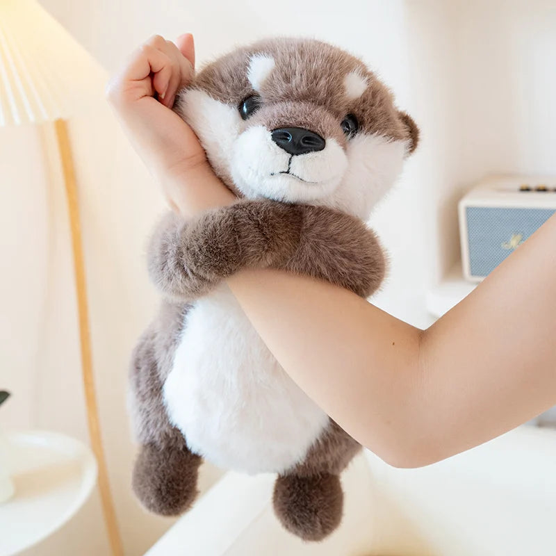 Kawaii otter simulation plush held in two adult hands showing 25cm size reference