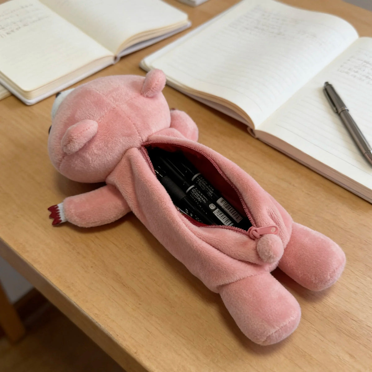 Kawaii pink bear pencil case open showing interior capacity for 10-15 pens