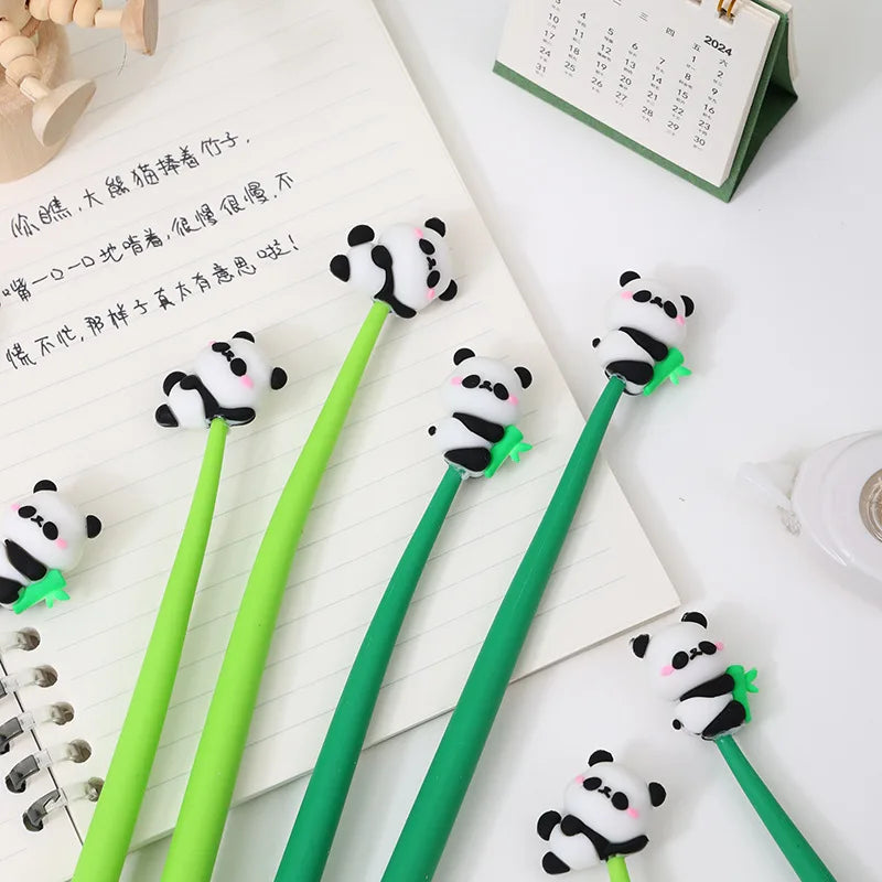 Hand holding kawaii panda gel pen showing soft silicone grip detail