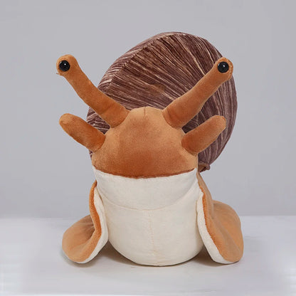 Soft kawaii snail stuffed animal showing spiral shell texture and short-pile plush fabric