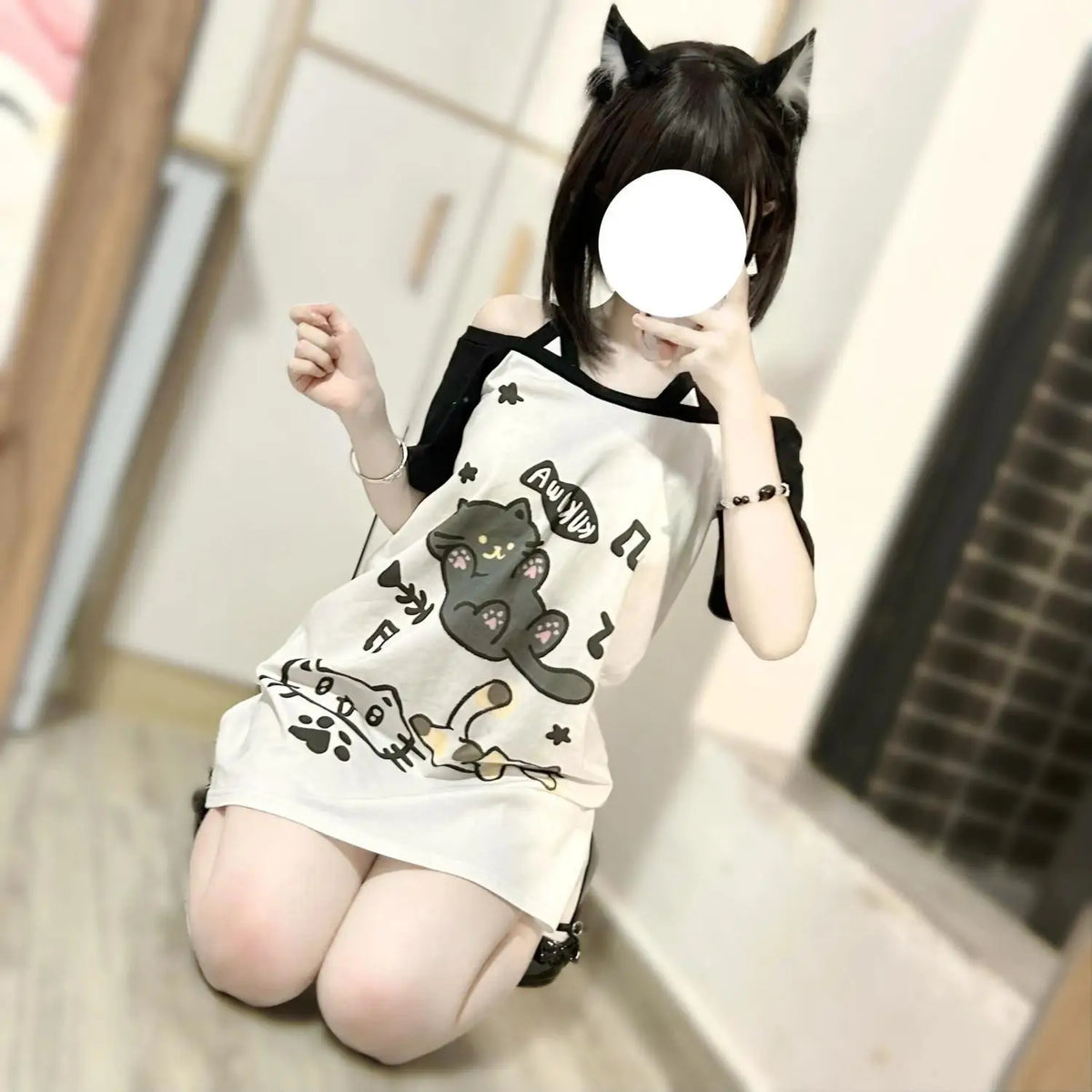 Kawaii patchwork cat tee side view showing loose Y2K silhouette and half sleeves