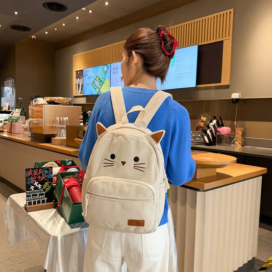 Kawaii cat backpack for women in khaki, front view showing embroidered cat face