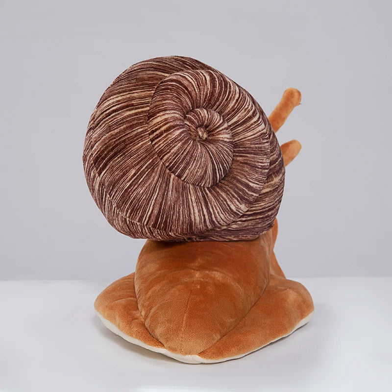 Kawaii snail stuffed animal used as sofa cushion in living room setting