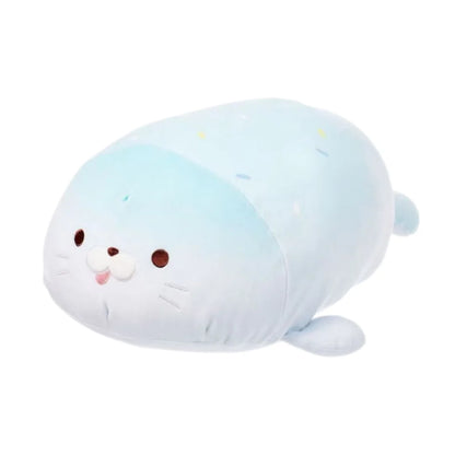 Pink kawaii seal stuffed animal 38cm propped against pillow on styled bed