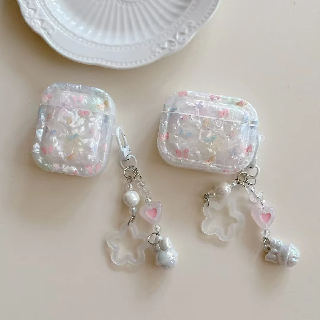 Kawaii AirPods case with matching floral bracelet laid flat on pastel background