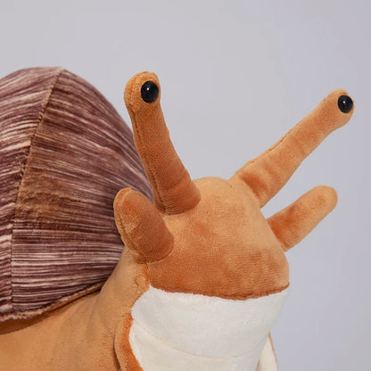 Kawaii snail plush pillow inside foam-padded gift box ready for gifting