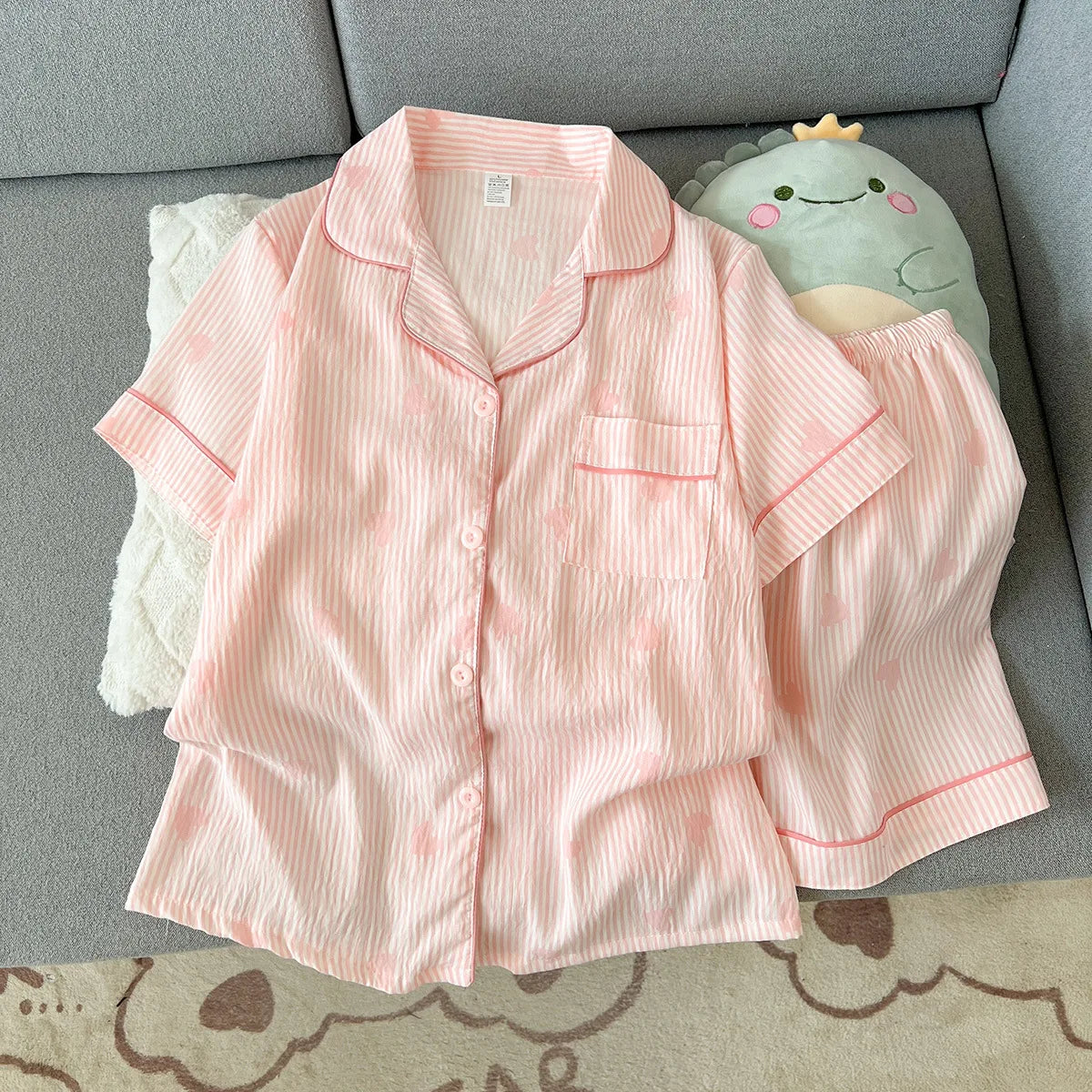 Kawaii-Faces floral short-sleeve pajama set, full outfit flat lay