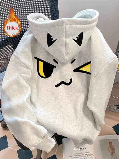 Kawaii-Faces Y2K sweatshirt women styled with pleated skirt winter outfit