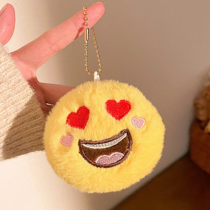 Bundle of three kawaii plush emoji keychain pendants packaged together as a gift set