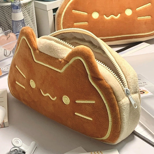 Kawaii cat fluffy pen case front view showing plush cat face and embroidery detail