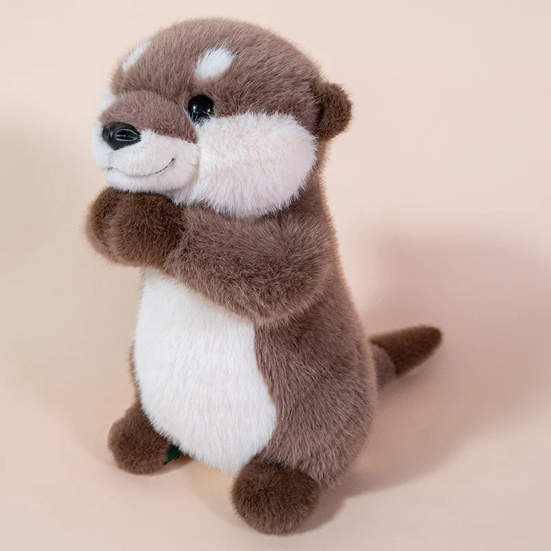 Kawaii otter plush toy on desk corner beside manga volumes and small plant, room decor context