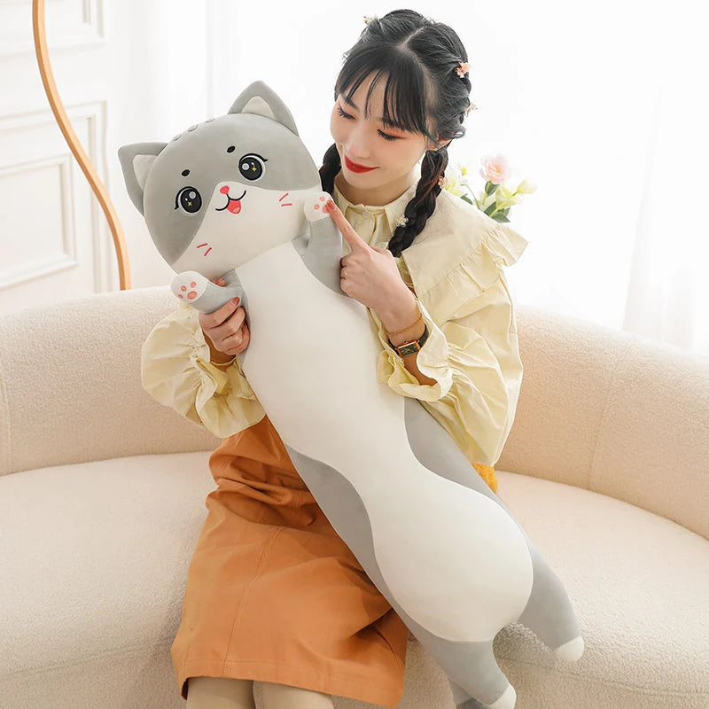 Long cat body pillow 90 cm on bed as sleeping companion