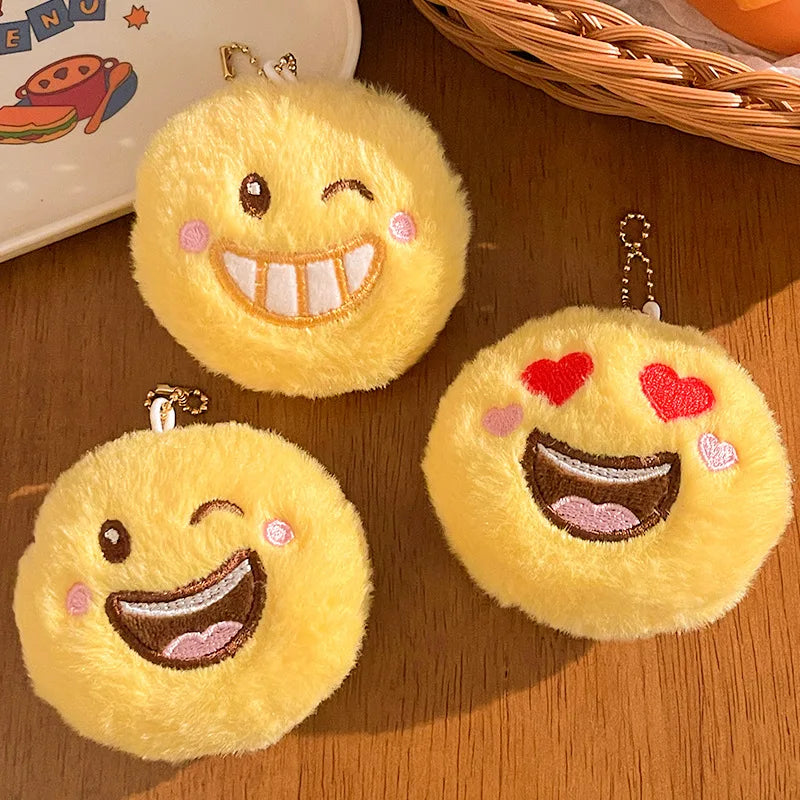 Kawaii emoji plush keychain pendant flat lay on neutral background showing full silhouette