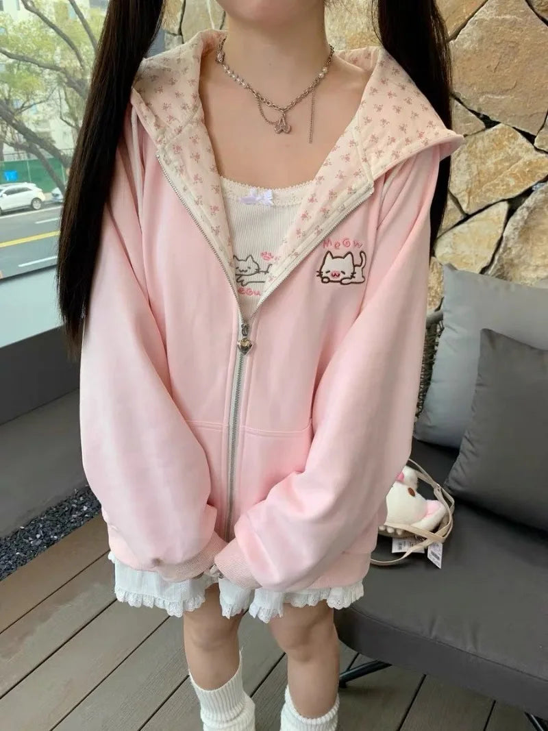 Kawaii cat zip-up hoodie flat lay showing broadcloth fabric texture and print quality