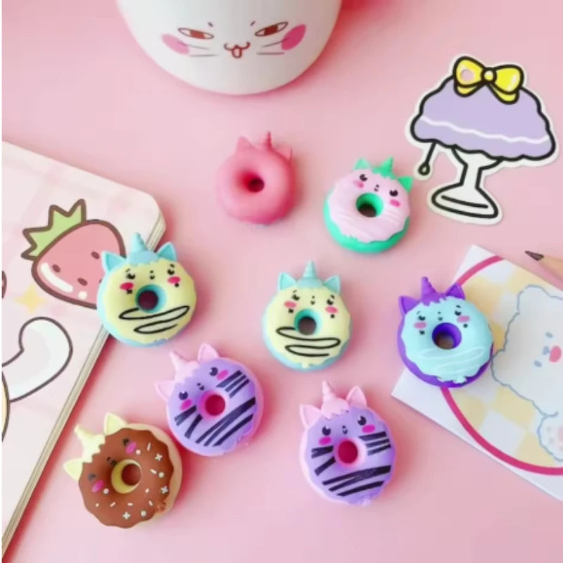 Close-up of kawaii doughnut eraser in blush pink rubber showing glaze detail