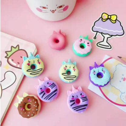 Close-up of kawaii doughnut eraser in blush pink rubber showing glaze detail