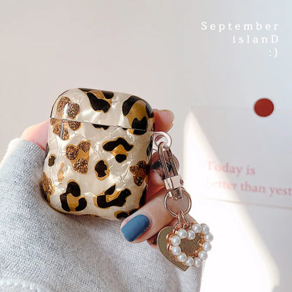 Leopard print AirPods Pro 2 case with shell pendant detail close-up