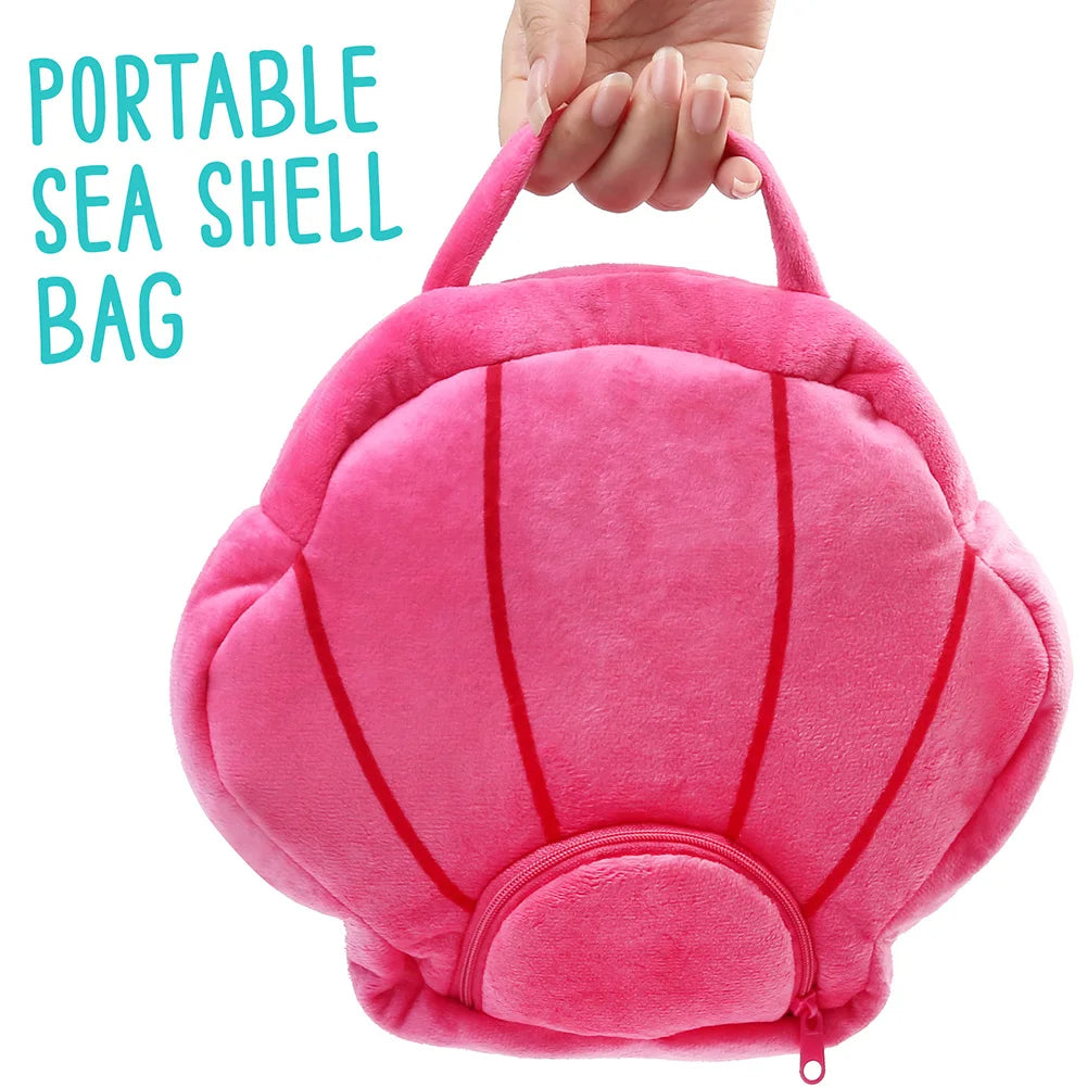 Child holding kawaii sea creature plush from the 5-piece ocean gift set