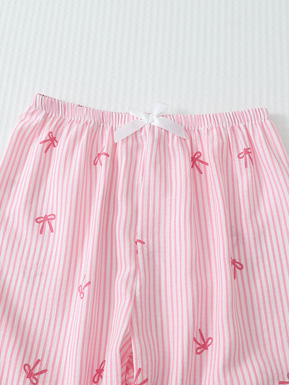 Pink bow pajama set back view long sleeve button-down women