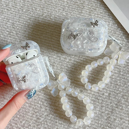Kawaii butterfly metal AirPods case with shell texture finish and pendant loop, front view