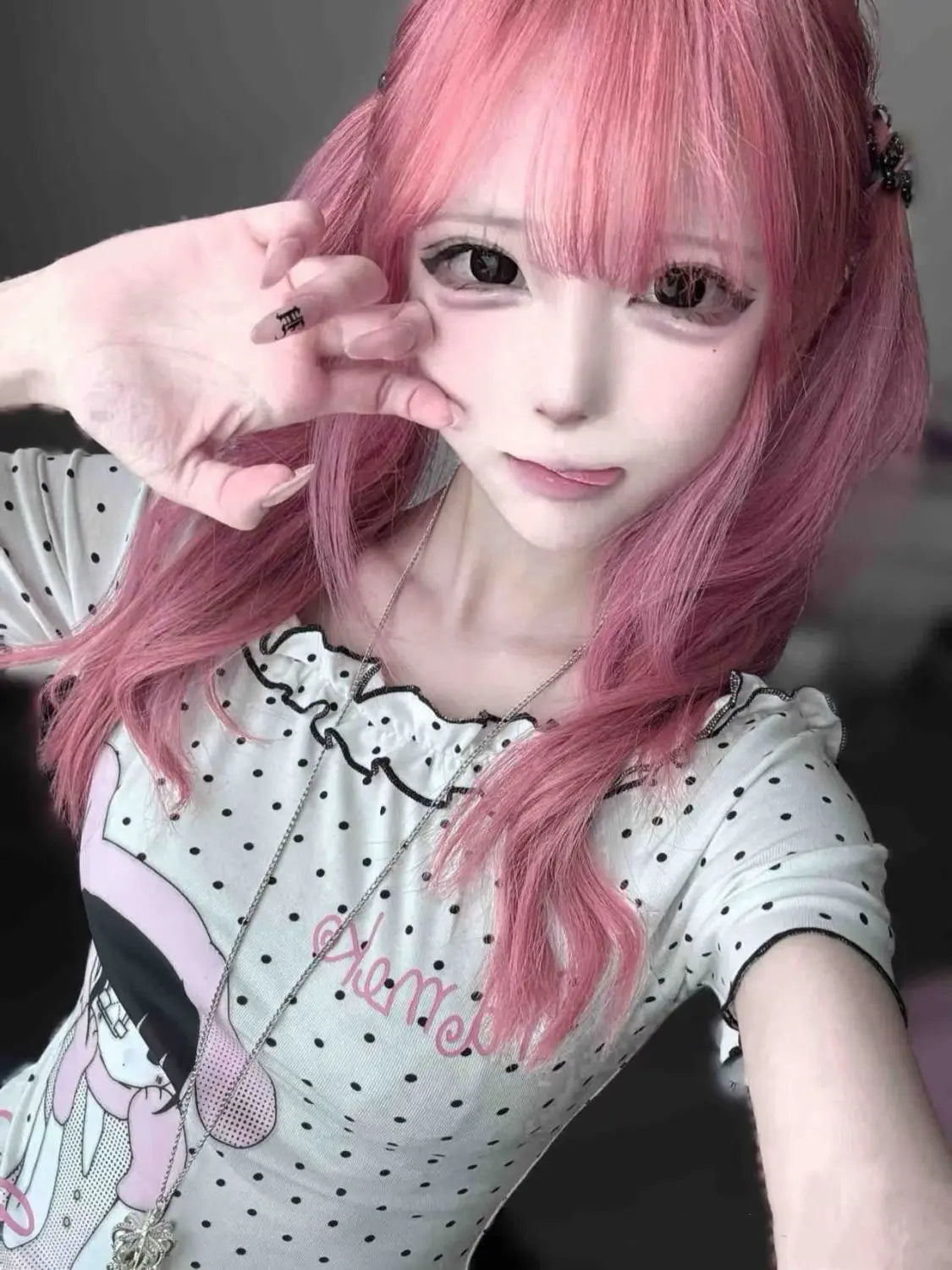Asymmetric slash neck kawaii T-shirt side view, polka dot cartoon print, fairy grunge style