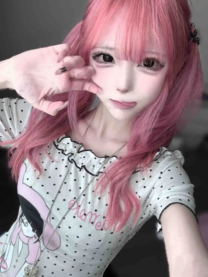 Asymmetric slash neck kawaii T-shirt side view, polka dot cartoon print, fairy grunge style
