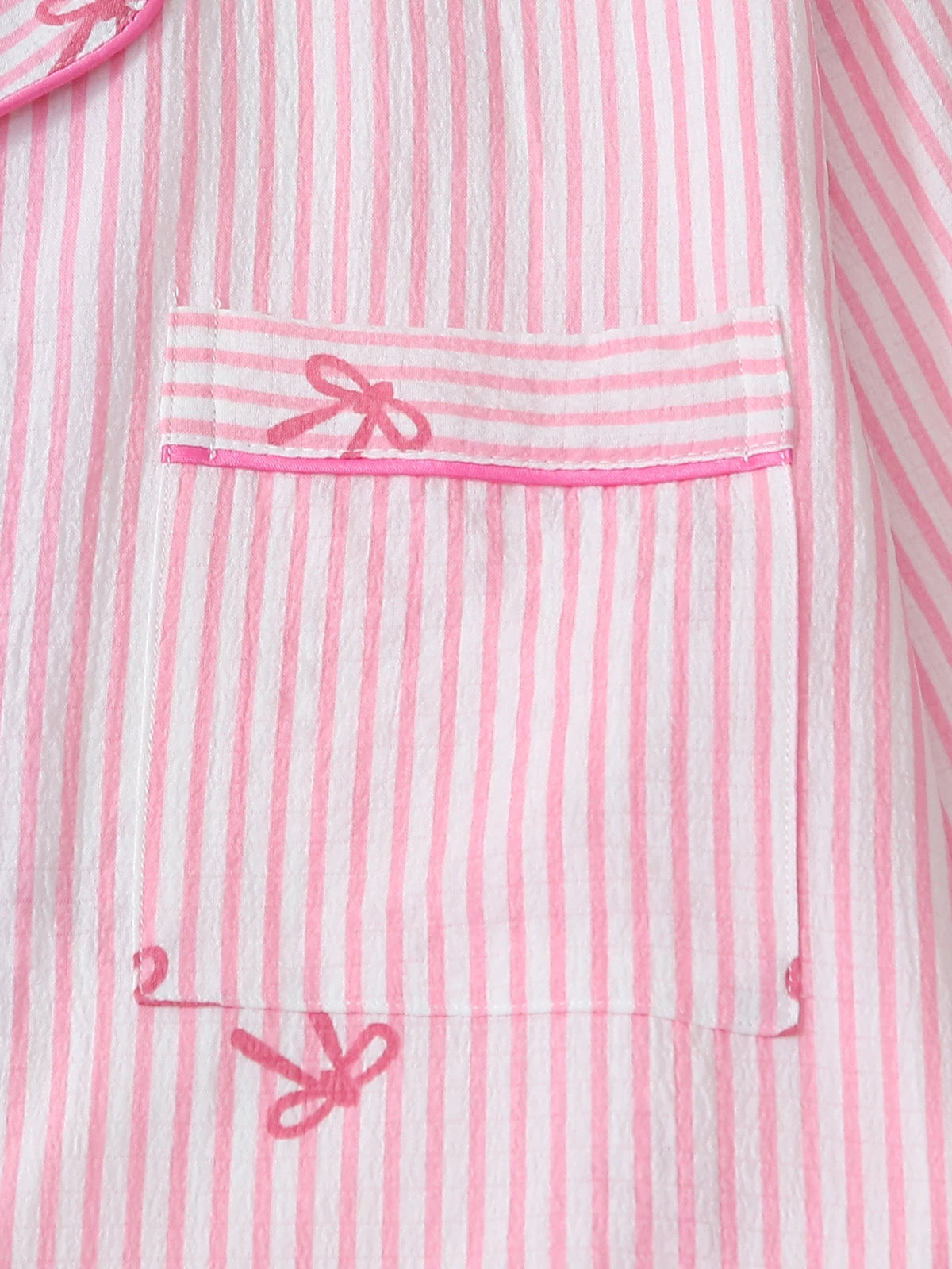Bow print pajama set pink white stripe pattern fabric close-up
