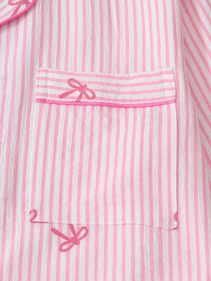 Bow print pajama set pink white stripe pattern fabric close-up