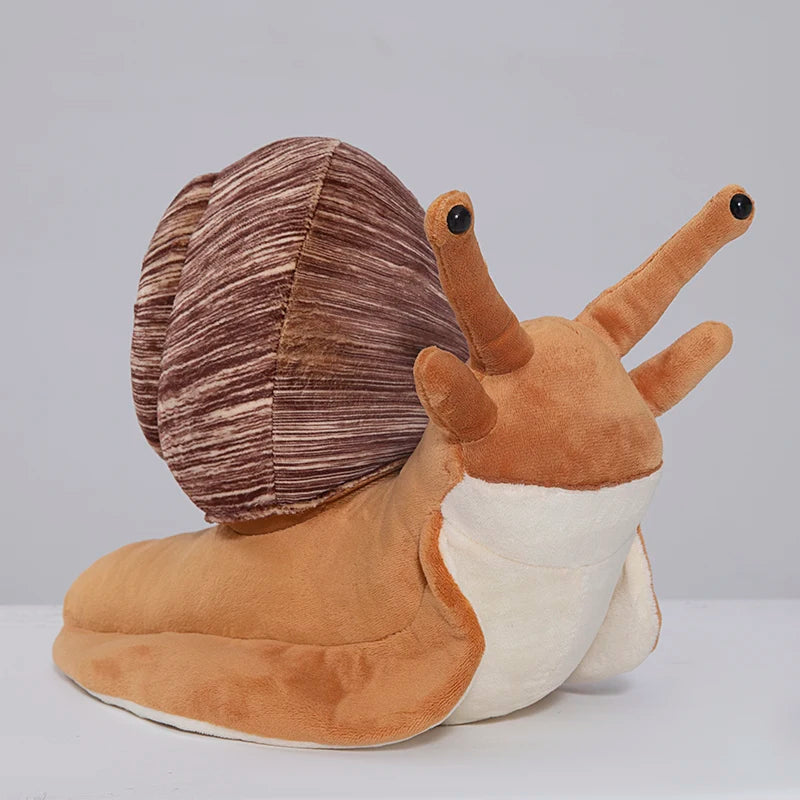 Close-up of kawaii snail plush embroidered eyes and facial expression on brown fabric