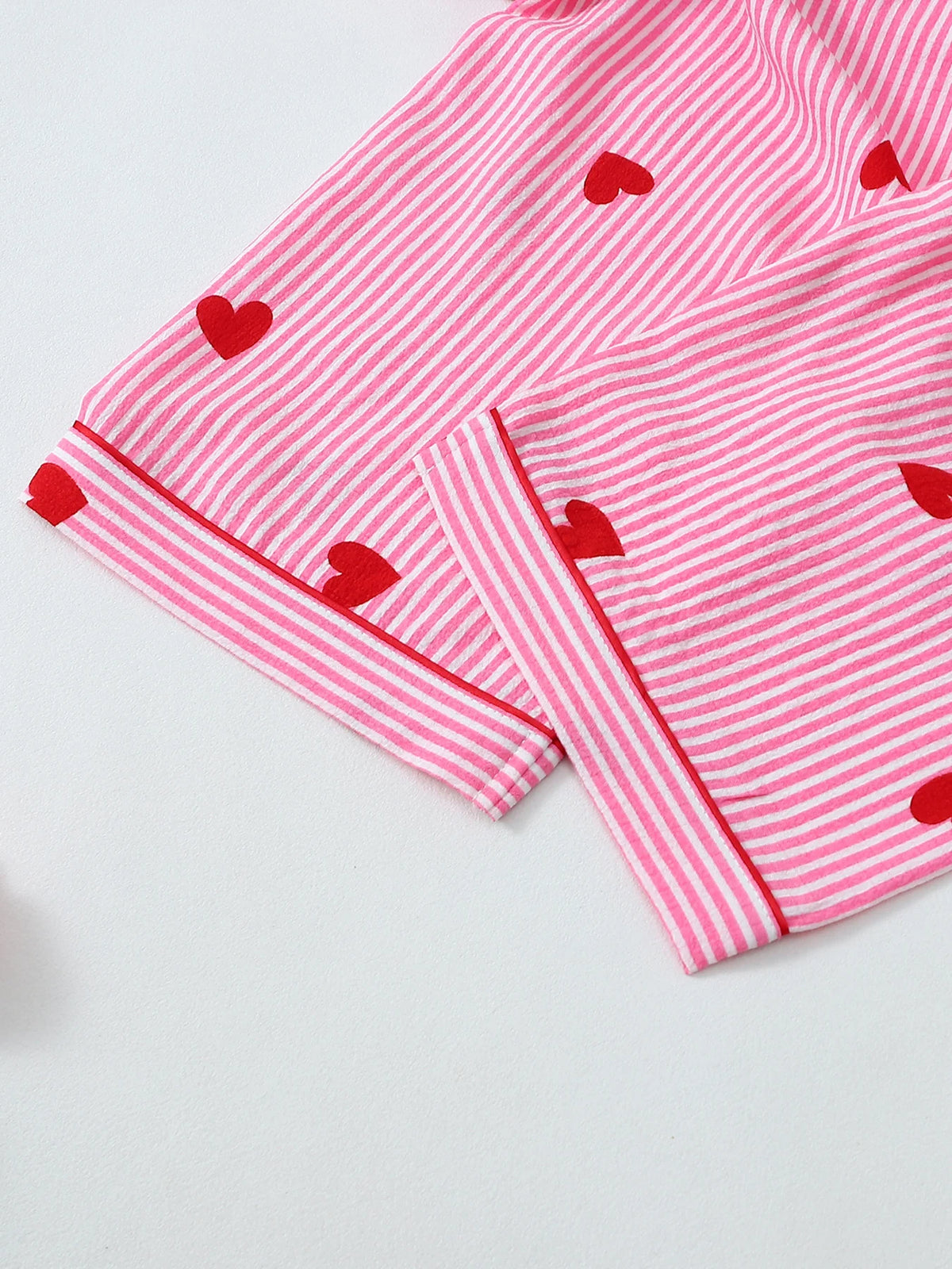 Kawaii pajama set detail showing notch lapel collar and all-over cute print fabric