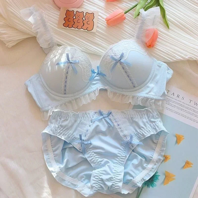Wire-free pink lace bralette back closure with four-row button fastening