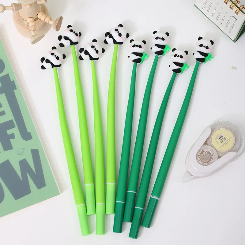 Set of 10 kawaii panda gel pens next to open planner and stationery accessories